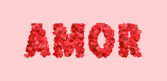 Word Amor laid out with paper hearts