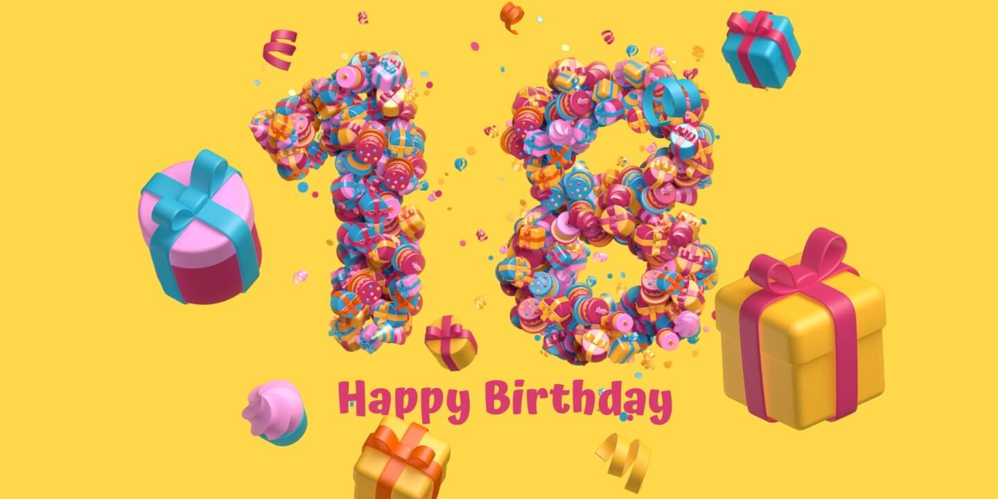 Birthday greeting card decorated with gift boxes and confetti.
